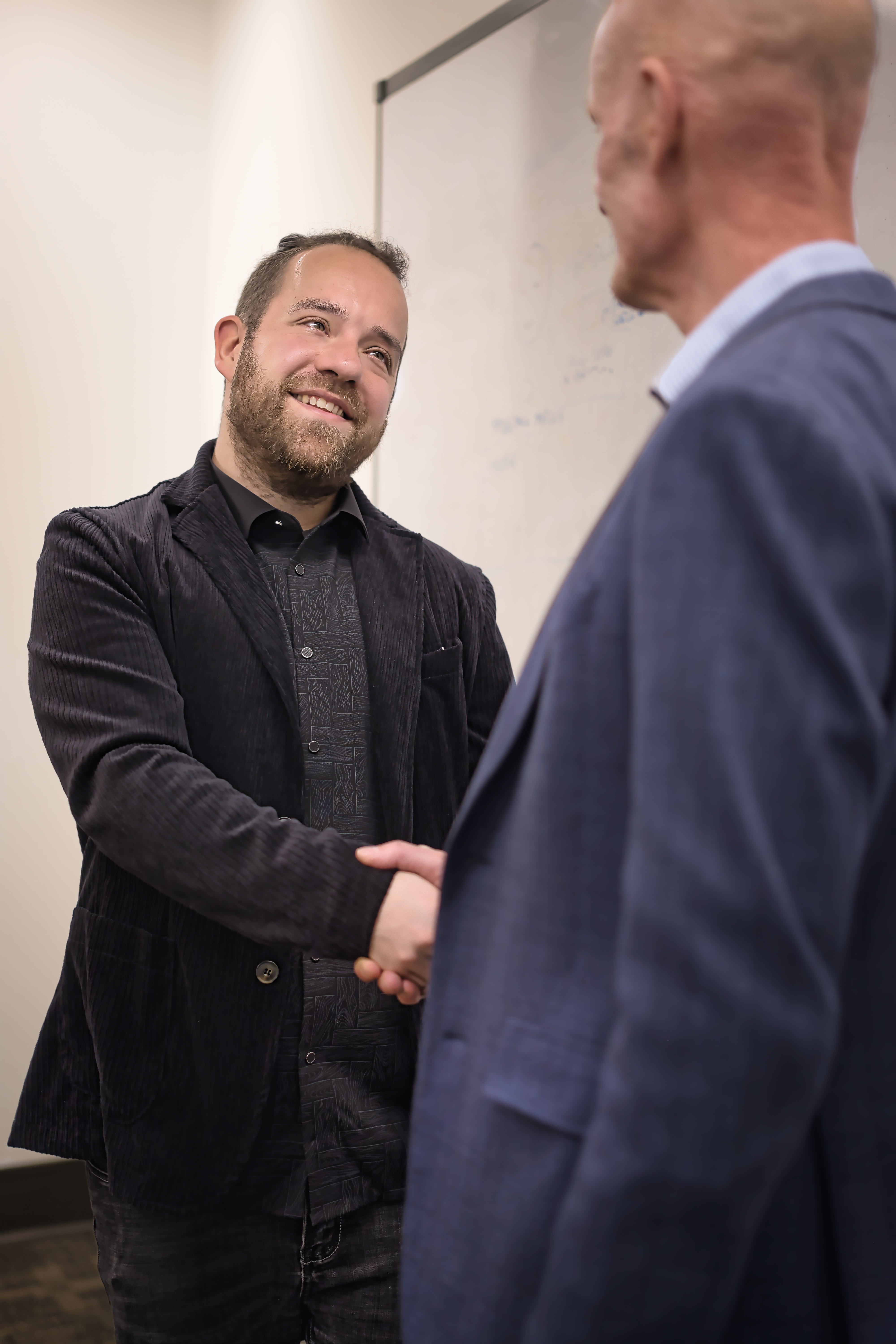 Sean Jeff shaking hands